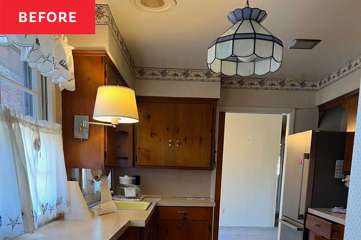Couple Transforms 1960s Kitchen with Blue Cabinets for $55,000